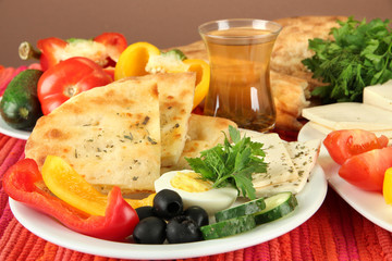 Traditional Turkish breakfast on table on brown background