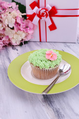 Tasty cupcake with butter cream,