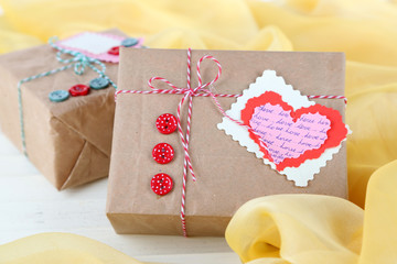 Paper gift boxes on wooden background