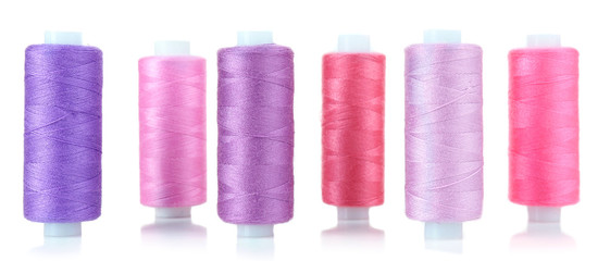 Colored spools of threads isolated on white