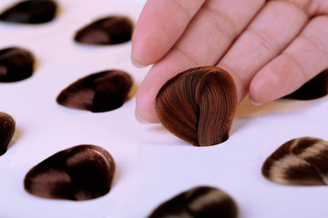 Hair samples of different colors on white background