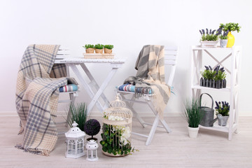Garden chairs and table with flowers