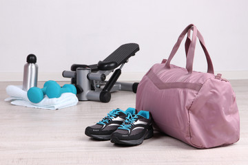 Sports bag with sports equipment in gymnasium
