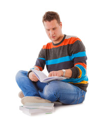 male student reading a book preparing for exam isolated