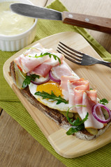 Bacon and fried eggs open sandwich