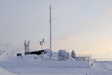 Snow-covered cell site in Arctic