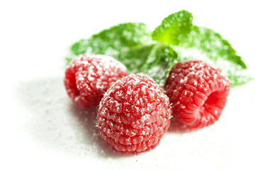 raspberries with mint on white
