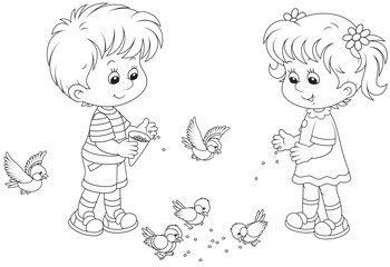 Boy and girl feed birds