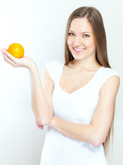 Portrait of a young beautiful woman with orange