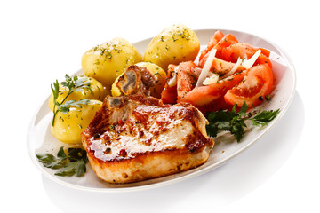 Grilled steak, boiled potatoes and vegetable salad