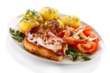Grilled steak, boiled potatoes and vegetable salad