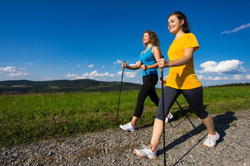 Nordic walking - active people working out outdoor - obrazy, fototapety, plakaty