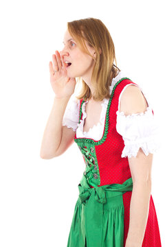 Bavarian woman in red dirndl is yodelling