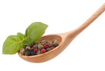 Pepper seasoning  mix in wooden spoon isolated on white backgrou