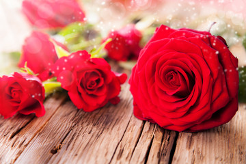 Red roses on wood