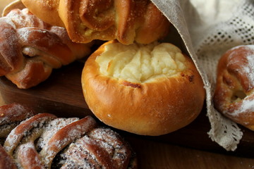 Fresh buns on wooden table