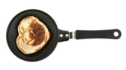 Heart shaped flapjack pancake in a pan