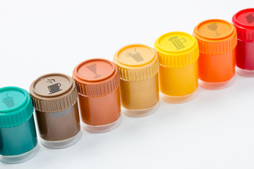 different colored pot with beverage symbols on them