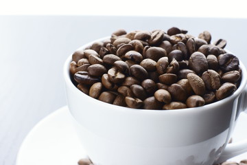 Coffee beans in cup