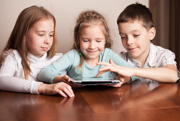 Children playing on tablet