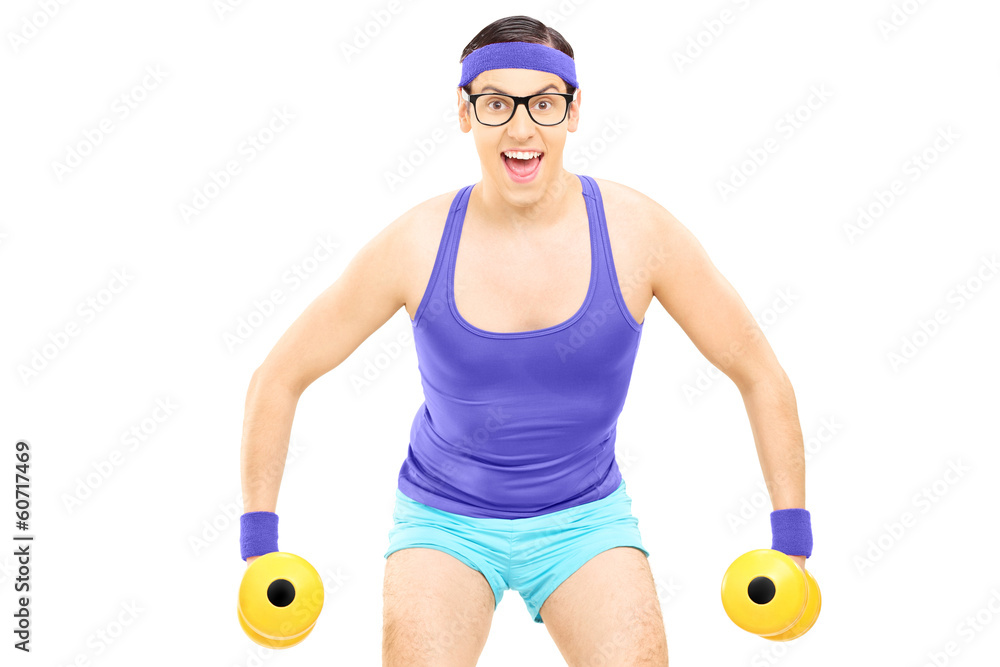 Wall mural Nerdy guy exercising with dumbbells