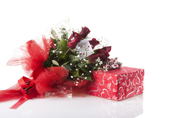 roses and gift on white