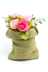 Artificial rose flower bouquet in small sack