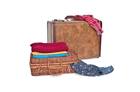 Suitcase, wicker trunk and clothes