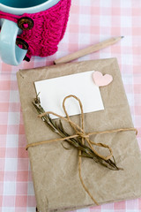 Old notebook with a dry branch of rosemary for love notes