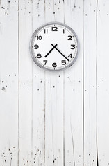 Clock on a bright wooden wall