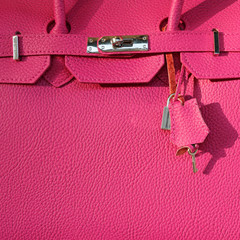 fragment of pink leather handbag