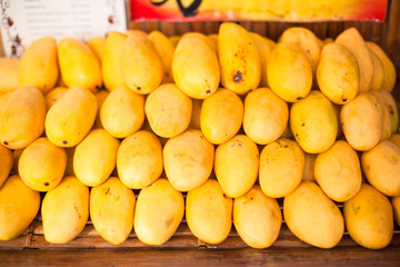 Naklejka na ściany i meble Yellow Mango in the local market on island of Boracay