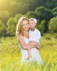 Fototapeta premium happy family on nature mother and baby daughter
