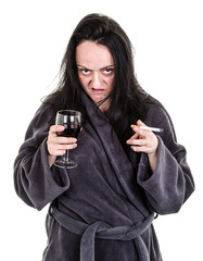 alcoholic, aggressive woman drinking red wine and smoking