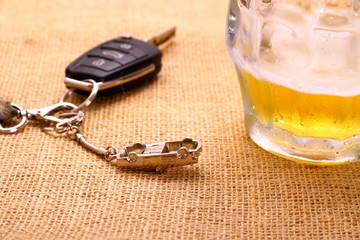 Car key with accident and beer mug