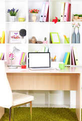 Workplace with laptop, close up