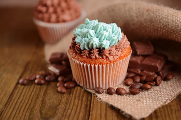 Tasty cupcakes with butter cream,