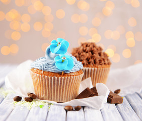 Tasty cupcakes with butter cream,