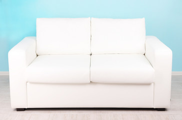White sofa in room on blue background