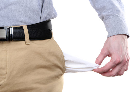 Man showing his empty pockets isolated on white