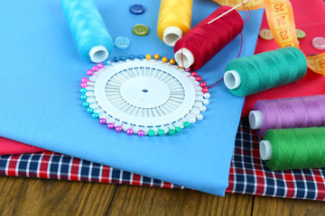 Sewing accessories on wooden table