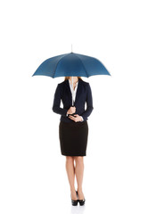 Beautiful caucasian business woman standing under umbrella.