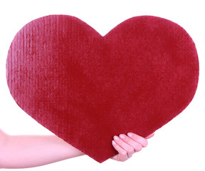 Hand holding big red heart isolated on white