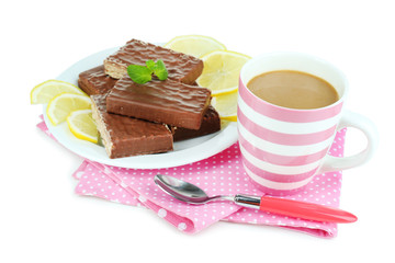 Cup of tea and sweets isolated on white