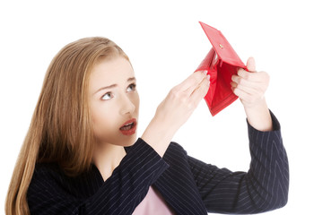 Beautiful caucasian business woman is checking empty wallet.
