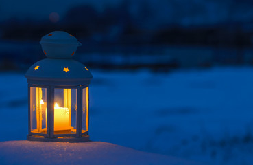 Lantern on snow