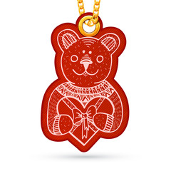 Teddy bear with present. Label tag hanging on golden chain.