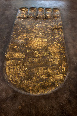 Buddha footprint at Wat Traphang Thong in Sukhothai