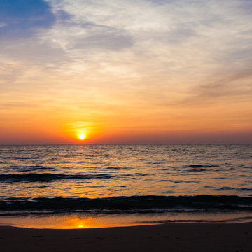 Sunset on the beach. sunrise in the sea © EwaStudio