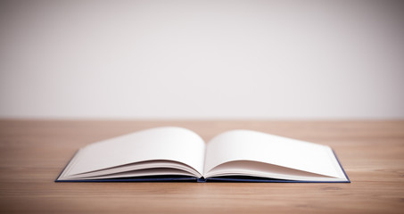 Open book on wooden deck